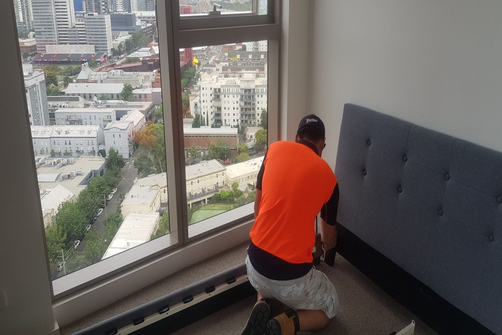 Our removalist assembling bedroom furniture in a Melbourne apartment