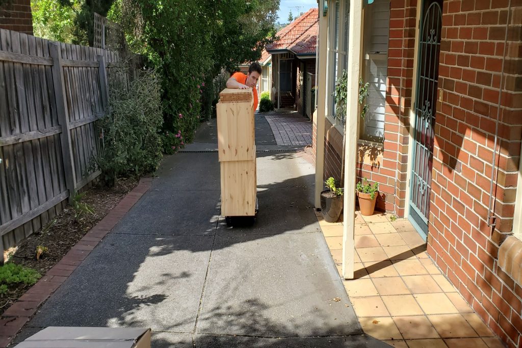 Our removalist transporting furniture during a home move