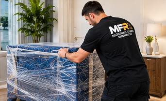 Melbourne Finest Removalists team member protecting bedroom furniture